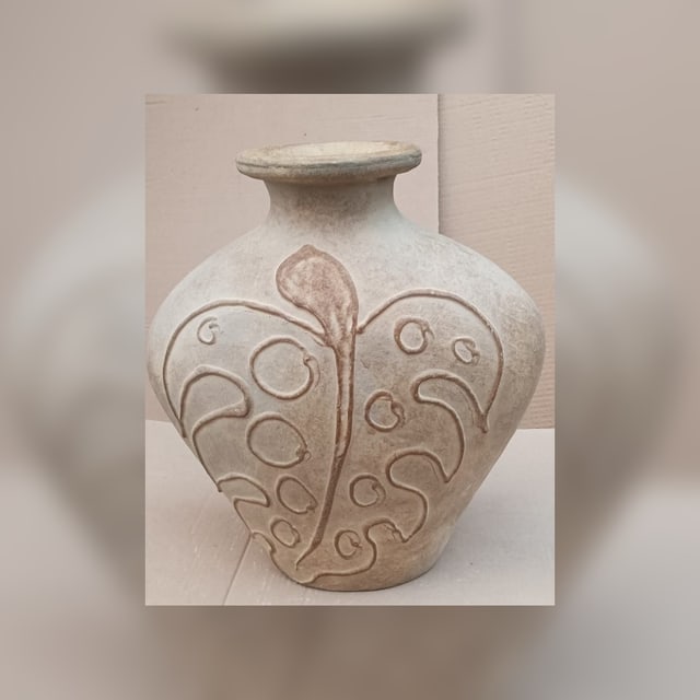 Decorative terracotta vessel with carved leaf motif
